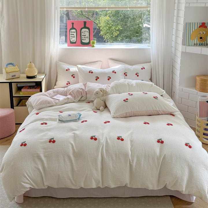 Quilted cotton bedding with cherry embroidery and reversible pillowcases