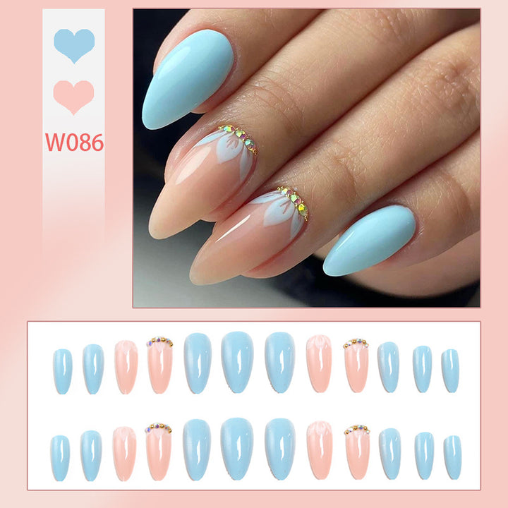 Artificial nails with elegant leaf patterns and rhinestone embellishments Stornfield