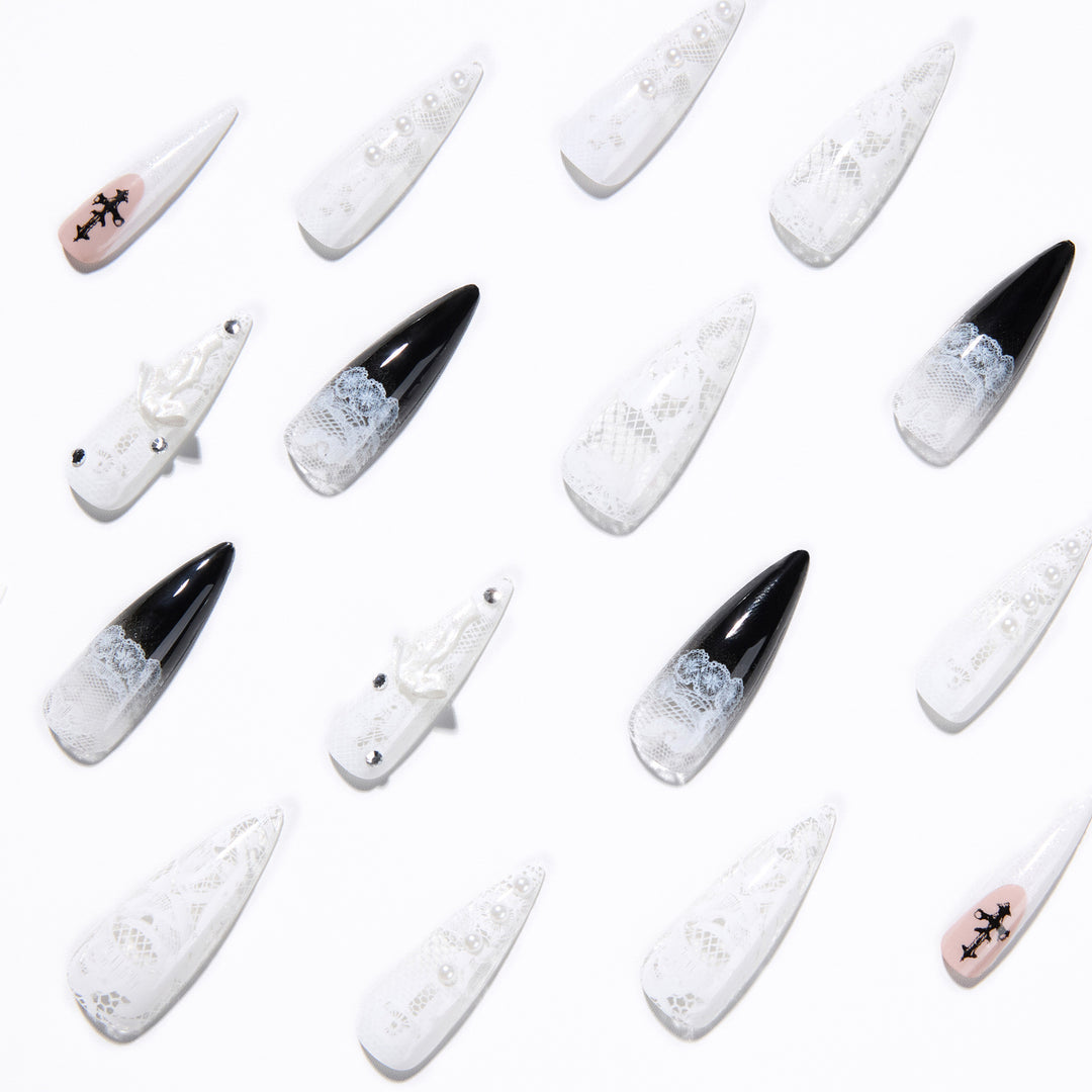 Artful stiletto nails with unique 3D elements and glitter accents Stornfield