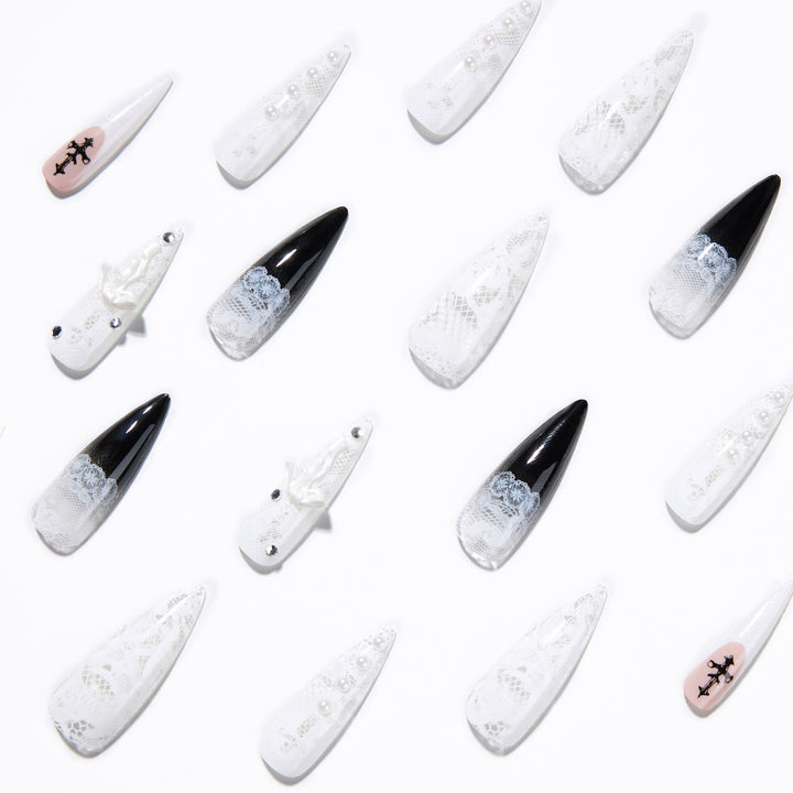 Artful stiletto nails with unique 3D elements and glitter accents Stornfield