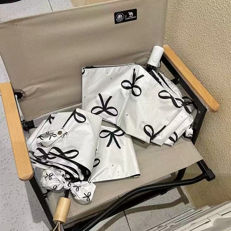 Women's foldable umbrella with elegant bow design Stornfield