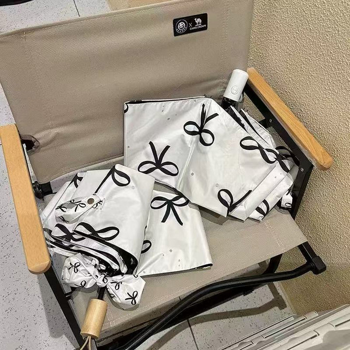 Women's foldable umbrella with elegant bow design Stornfield