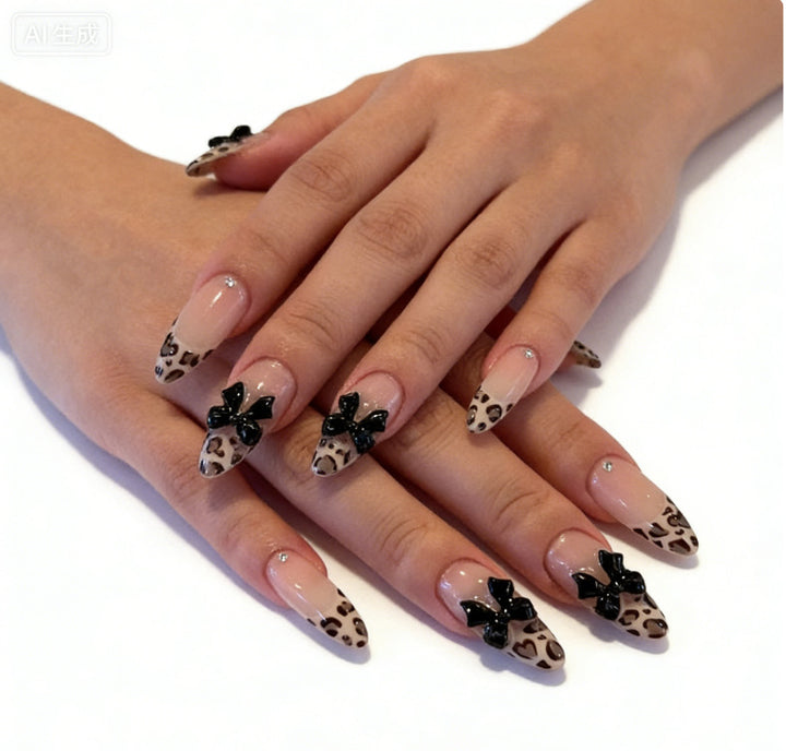 Creative artificial nails with stylish leopard pattern and bow accents Stornfield