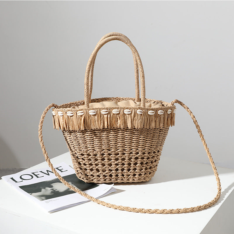 Braided straw bag with decorative tassel detail Stornfield