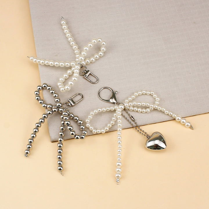 Elegant Pearl Bow Brooch Stornfield