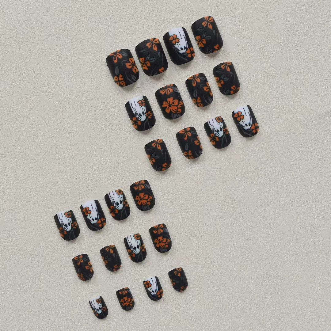 Acrylic nail set with spooky ghost design and floral accents Stornfield