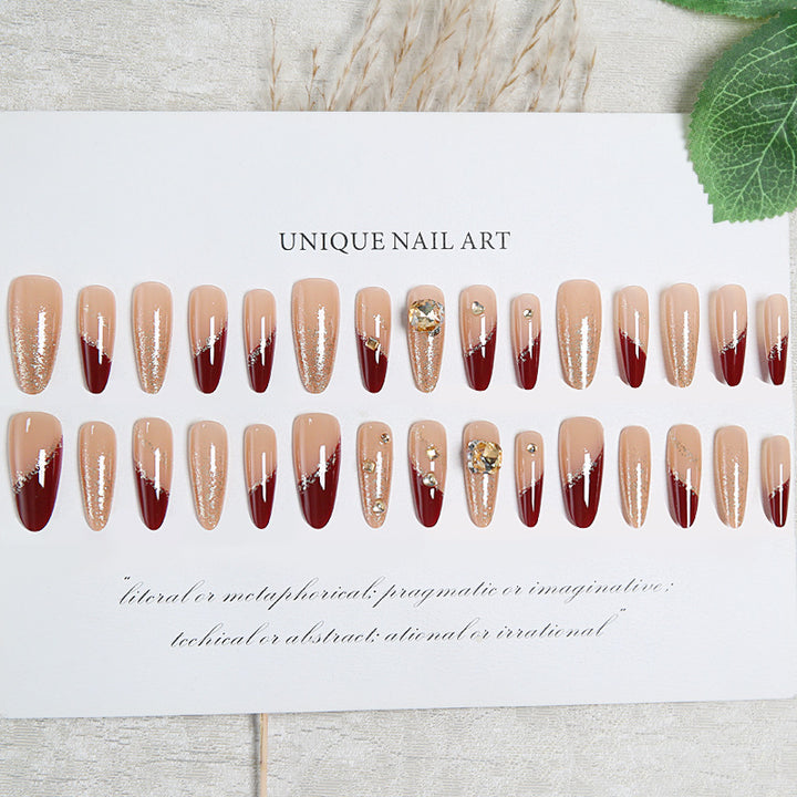 Acrylic nail set with elegant glitter design and exclusive embellishments Stornfield