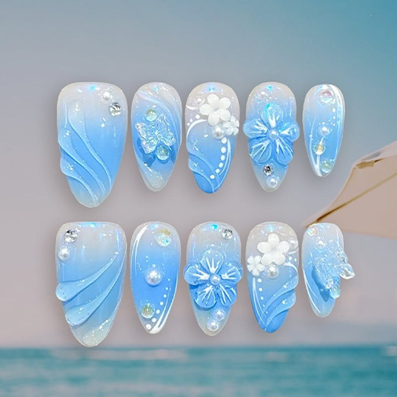 Creative nail set with floral accents and glittering details Stornfield