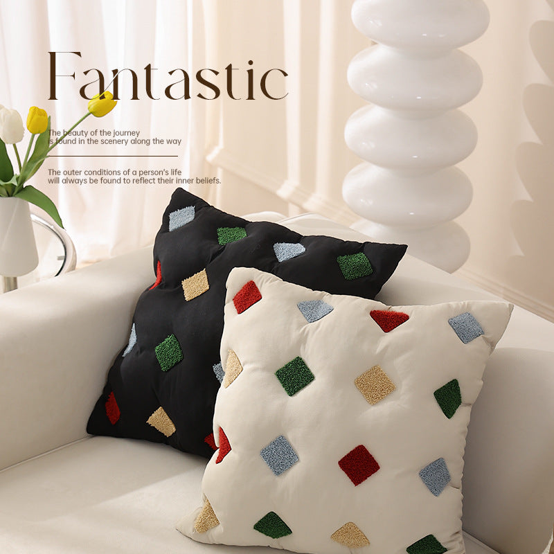 Filled decorative cushion with colorful tuft diamonds and padded structure