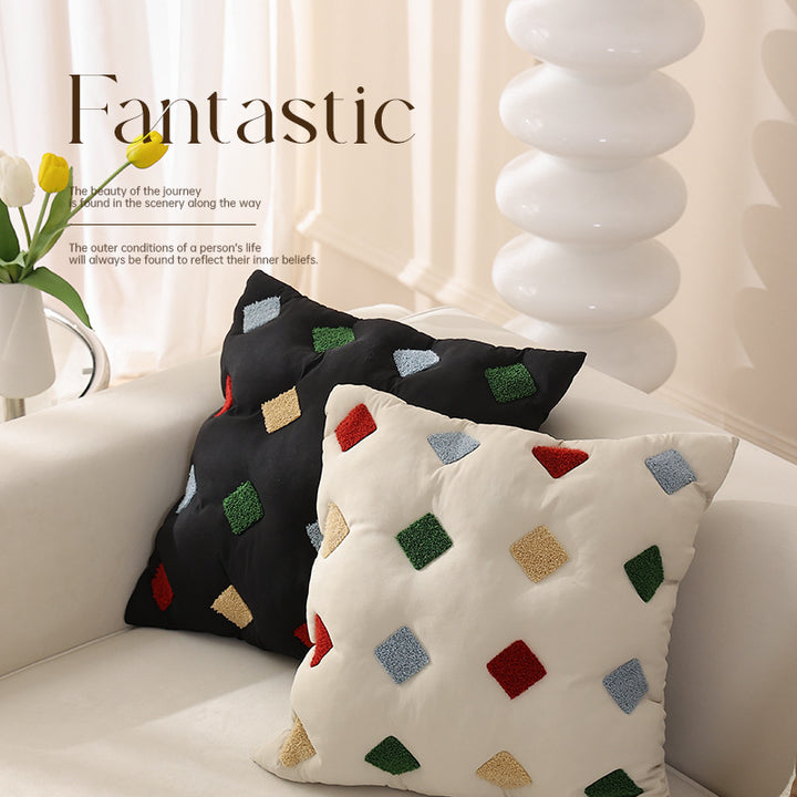 Filled decorative cushion with colorful tuft diamonds and padded structure