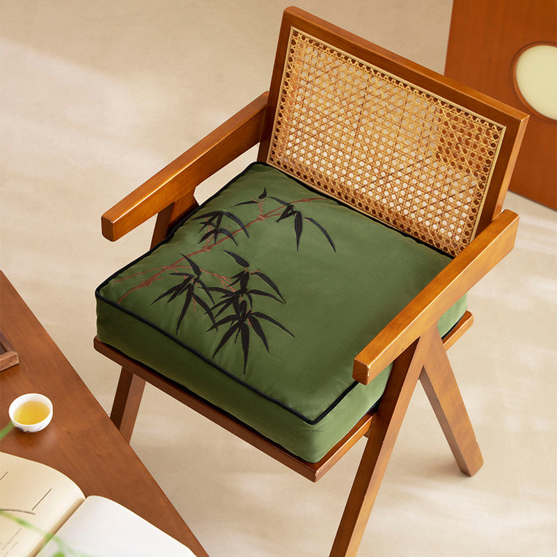 Padded cotton-linen seat cushion with embroidered bamboo motif and contrasting piping Stornfield