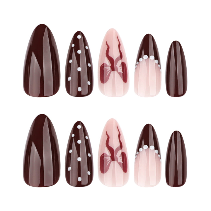 Elegantly designed stiletto nails with artistic accents Stornfield