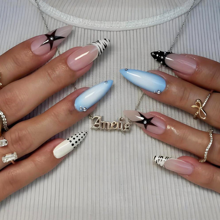Acrylic nail set with stylish geometric designs and glamorous accents Stornfield