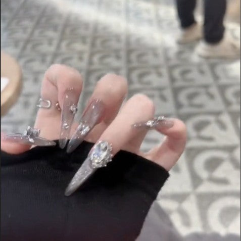 Glamorous artificial nails with rhinestone accents Stornfield