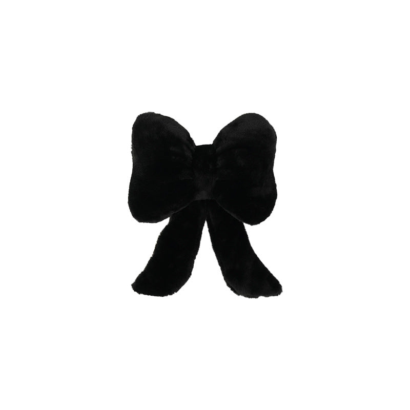 plush bow-shaped decorative throw cushion with long tails and faux-fur texture Stornfield