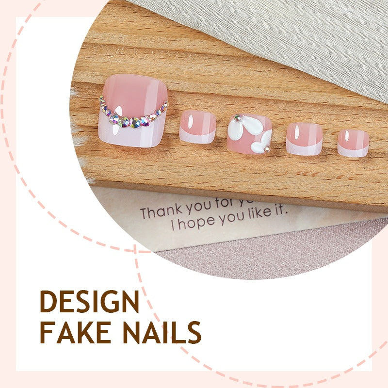 Creative nail art set with elegant flower designs and glitter accents Stornfield