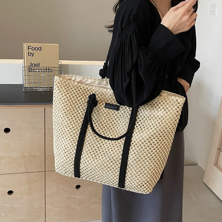Beach bag made of hand-woven natural material with sturdy handles Stornfield