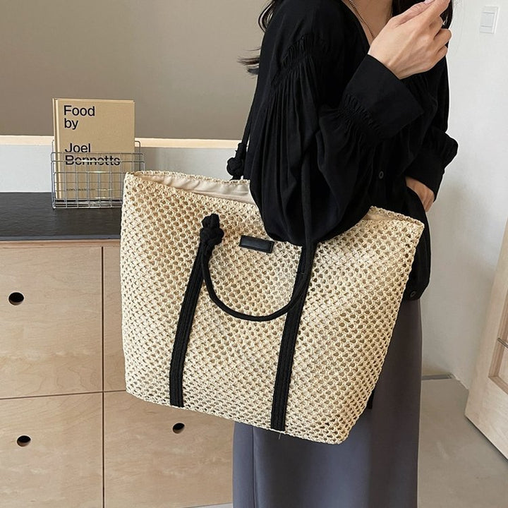 Beach bag made of hand-woven natural material with sturdy handles Stornfield