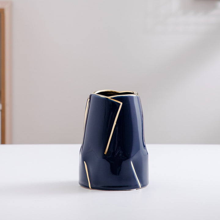 Decorative ceramic vase with golden accents Stornfield