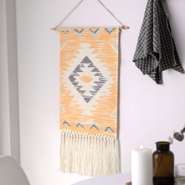 Woven Boho wall tapestry in Ethno design with long fringes and wood stick Stornfield