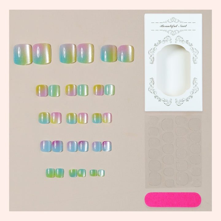 Acrylic nail set with shimmering gradient and elegant designs Stornfield
