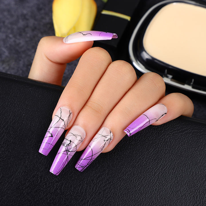 Artificial nails in modern ombre design with marbled accents Stornfield