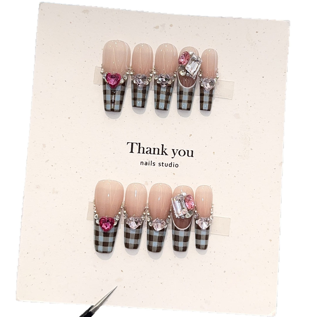 Artificial nails with elegant checkered pattern and jewelry details Stornfield
