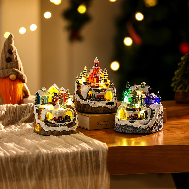 Illuminated Christmas village scene with snowman Stornfield