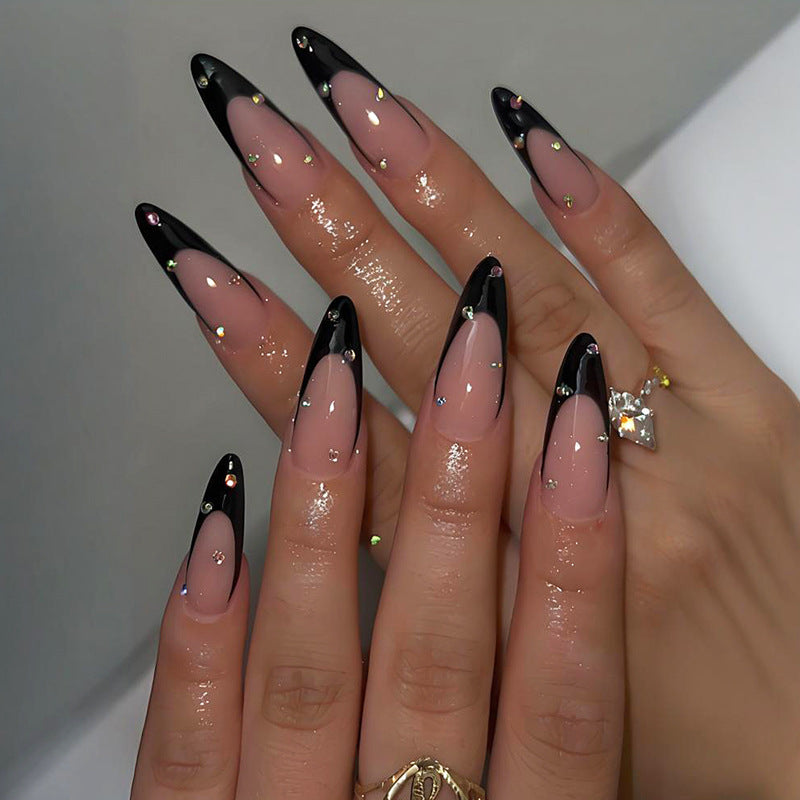 Artificial nail set with elegant tips and glamorous decorations Stornfield
