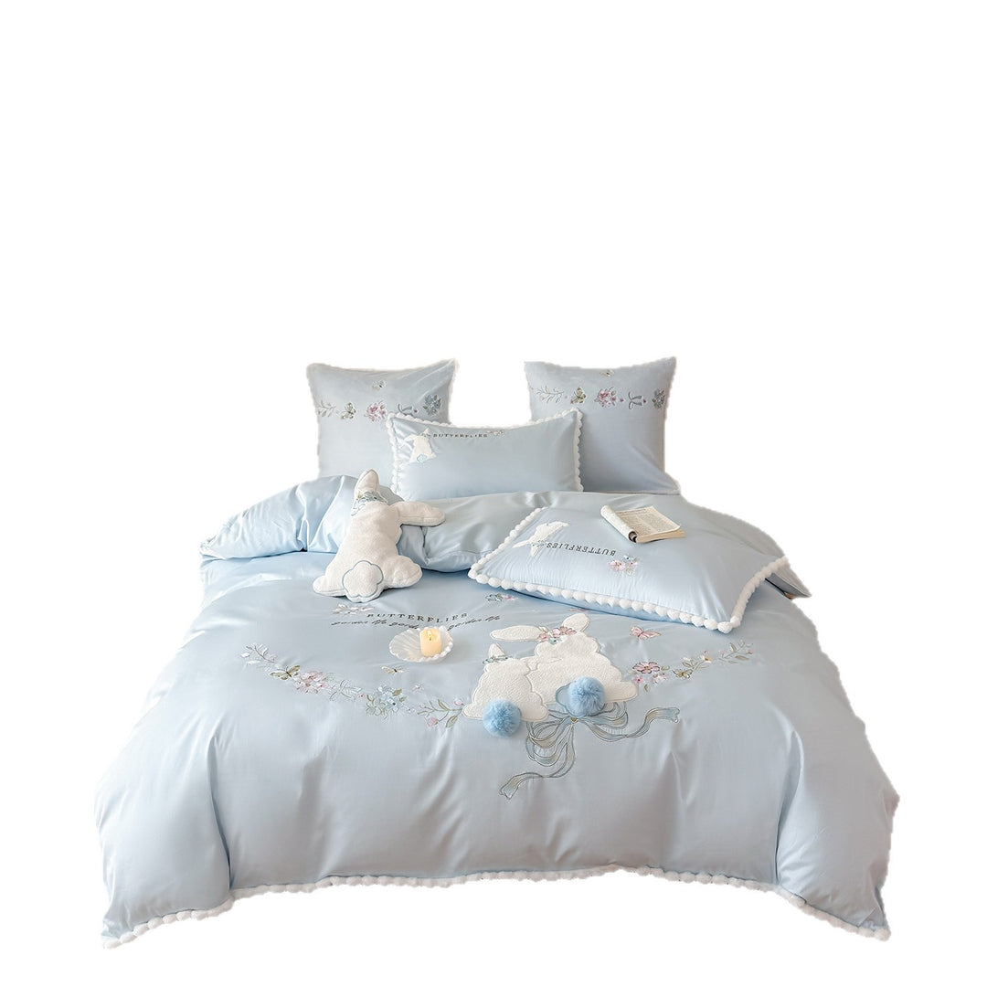Playful cotton satin bedding set with appliquéd bunny pom-pom trim and floral embroidery
