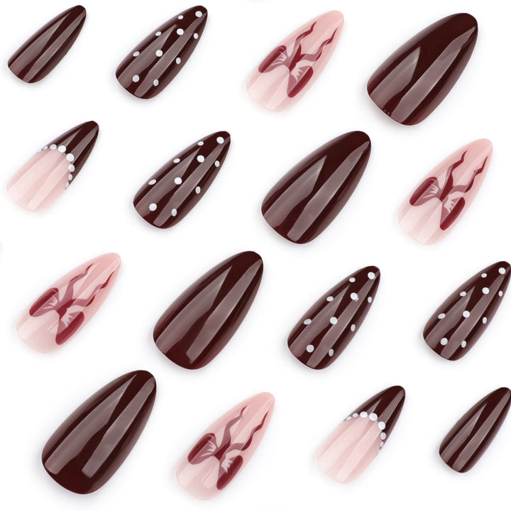 Elegantly designed stiletto nails with artistic accents Stornfield
