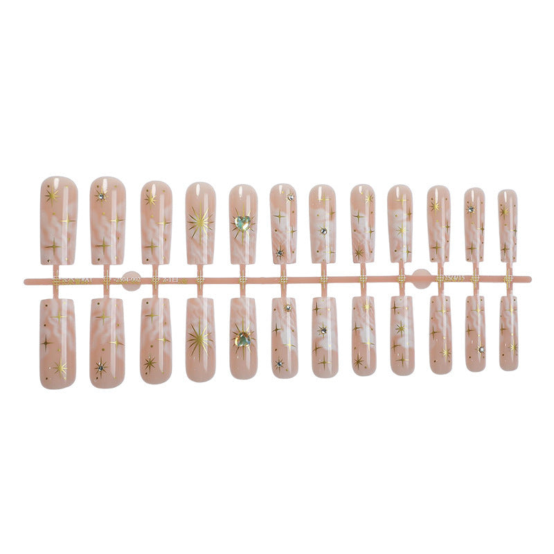 Nail set with glamorous gold decorations Stornfield