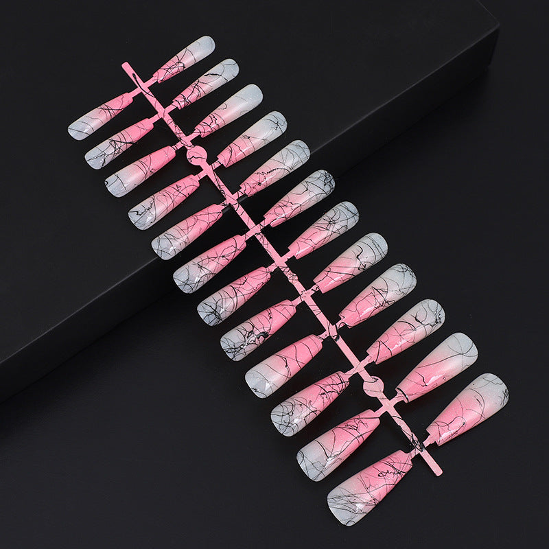 Artificial nails in modern ombre design with marbled accents Stornfield