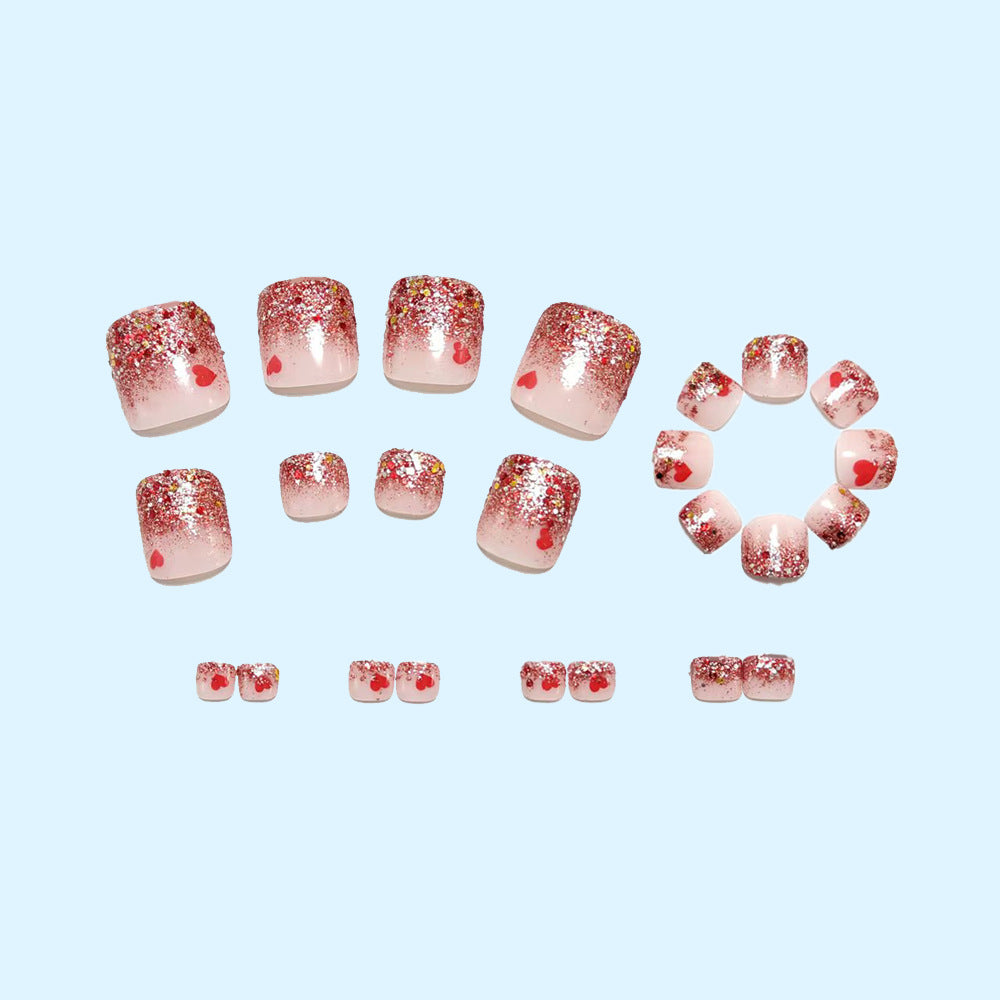 Artificial nails with glitter and heart pattern Stornfield