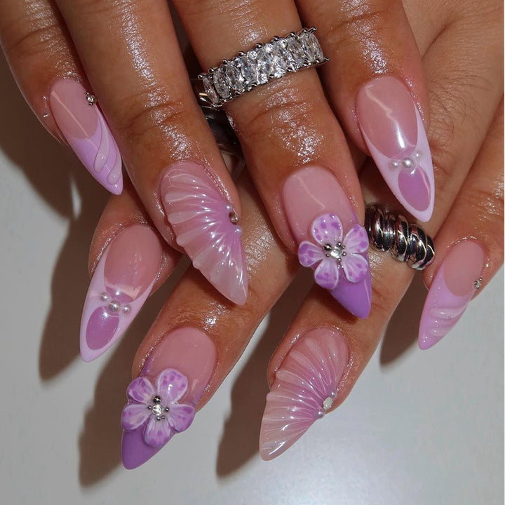 Artistic Stiletto Press-On Nail Art with Floral and Gemstone Accents Stornfield