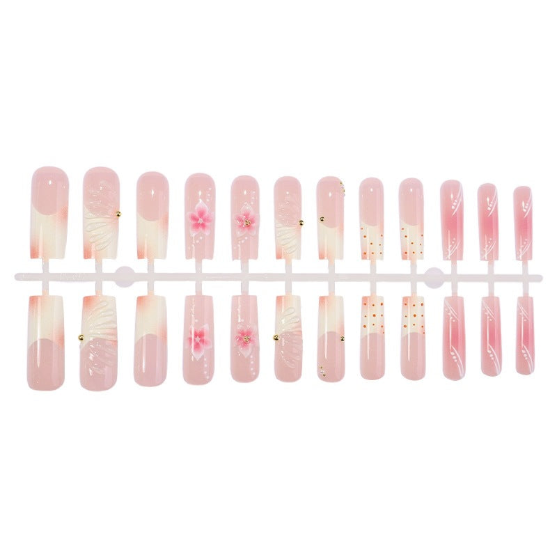 Creative nail art set with floral accents and glitter details Stornfield