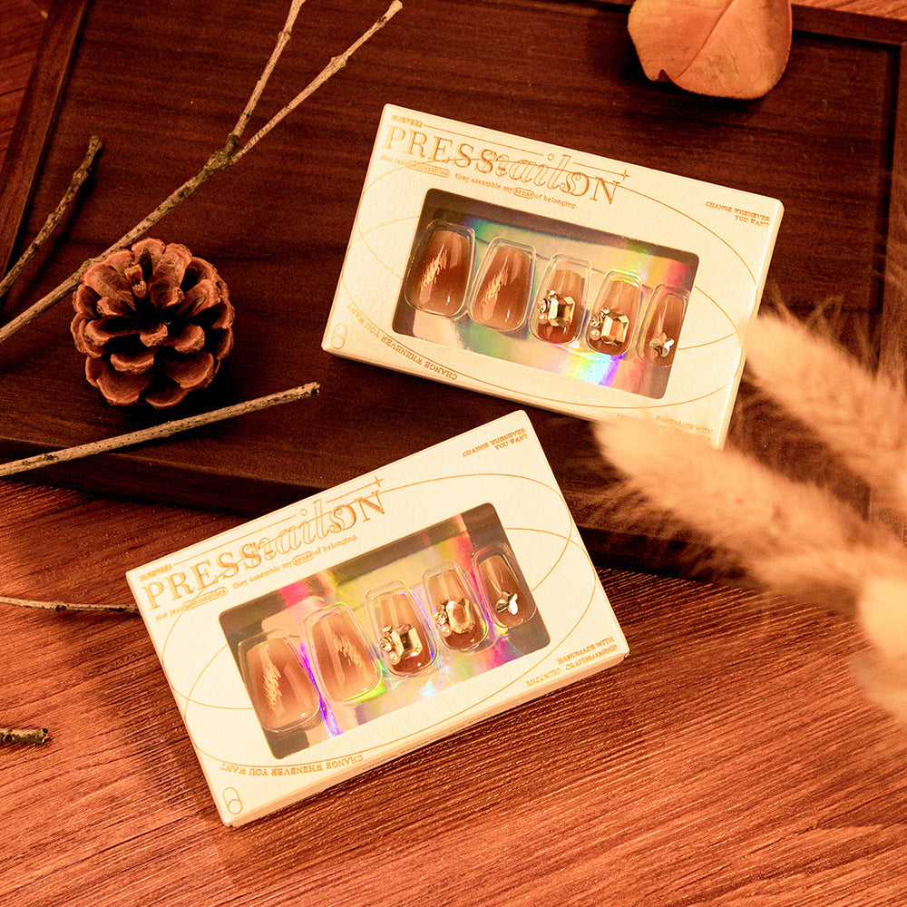 Artificial nail art with elegant jewelry accents Stornfield