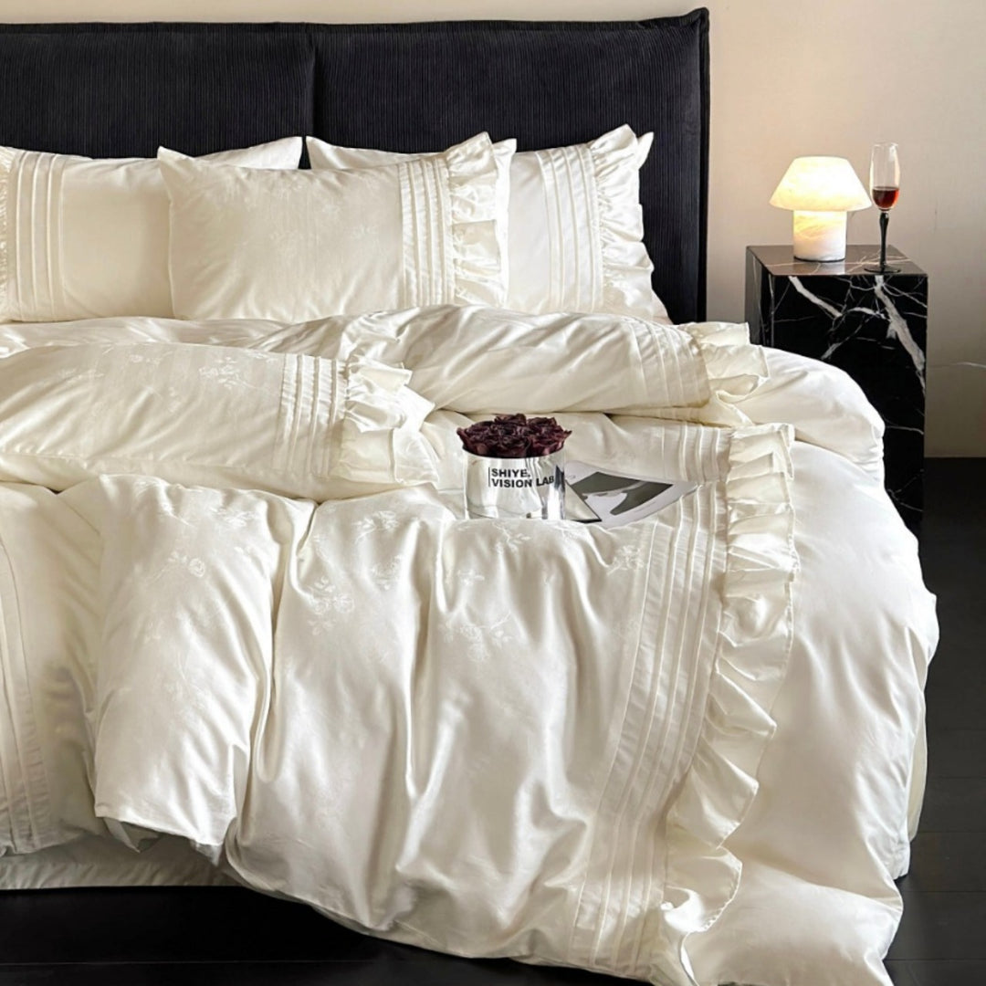 Luxurious satin bedding set with ruffles and delicate floral embroidery