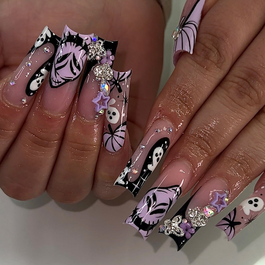 Artificail nails with creative Halloween design and glitter accents Stornfield