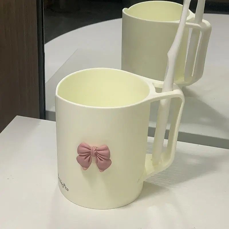Ceramic mug with elegant bow motif Stornfield