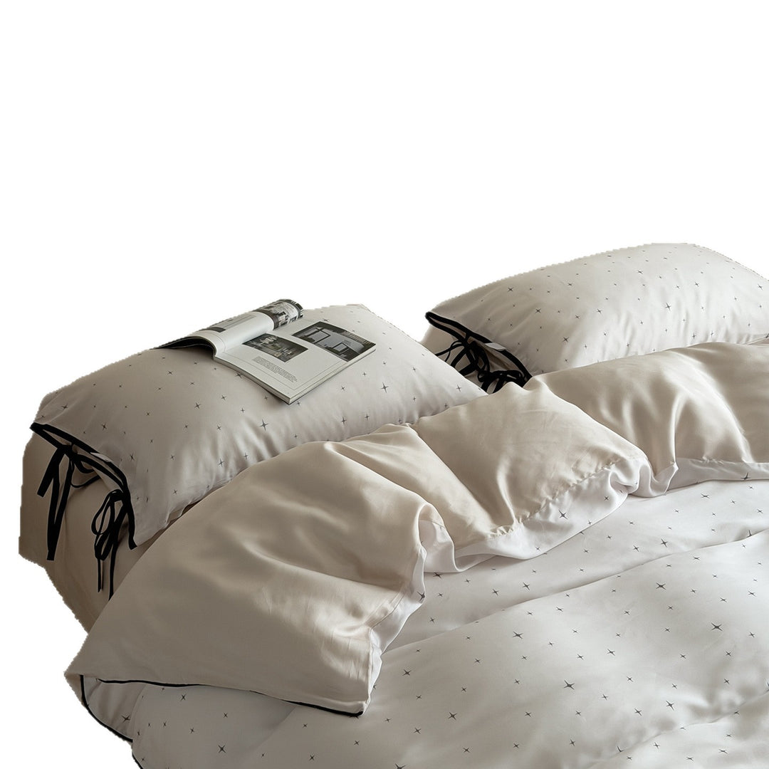 Bedding set with fine star pattern and pillow tie ribbons