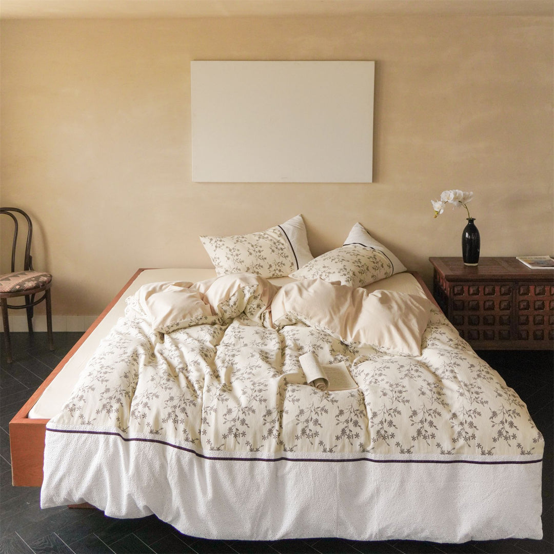 Cotton bedding set with waffle structure, fine floral print and decorative ribbon