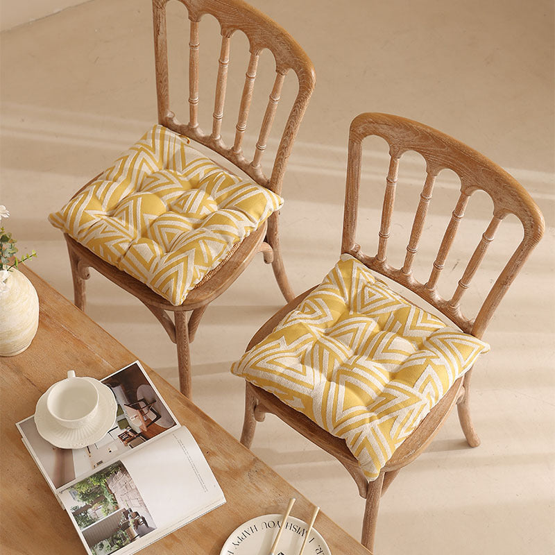 Padded quilted seat cushion with colorful button applications and non-slip underside Stornfield