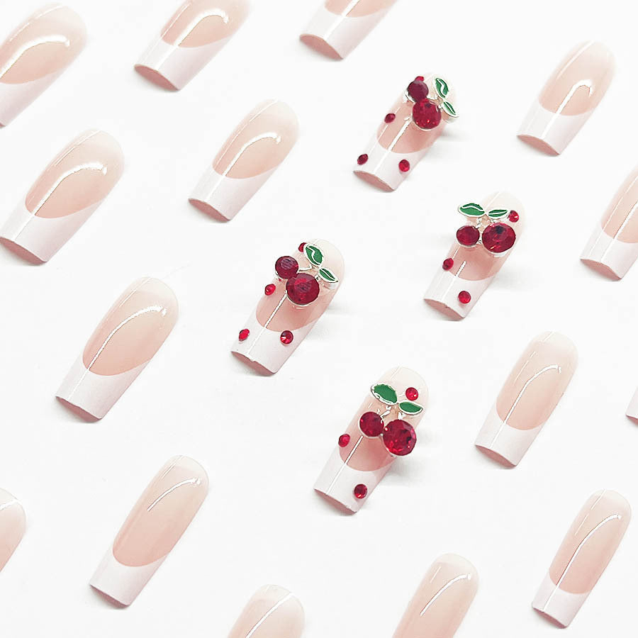 Acrylic nail set with chic cherry motifs and elegant French tip Stornfield