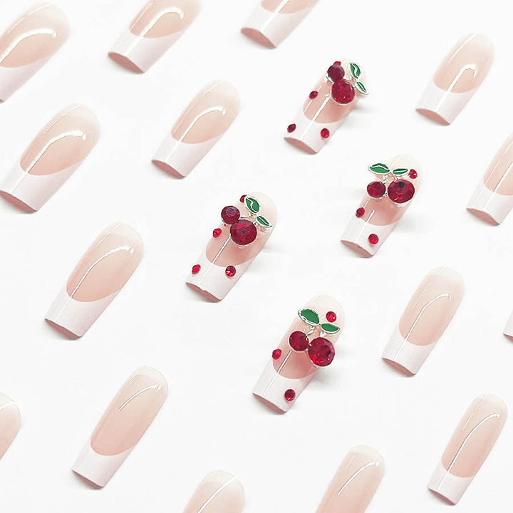 Acrylic nail set with chic cherry motifs and elegant French tip Stornfield