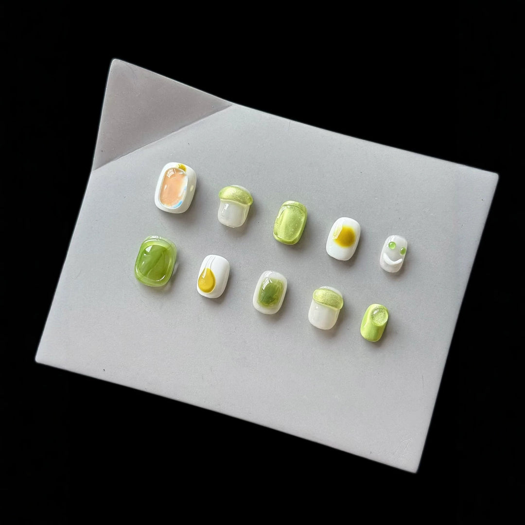 Artistic Press-On Nail Art Set with Playful Character Designs
