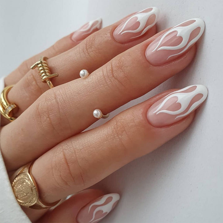 Artful stiletto nails with heart-shaped accents Stornfield