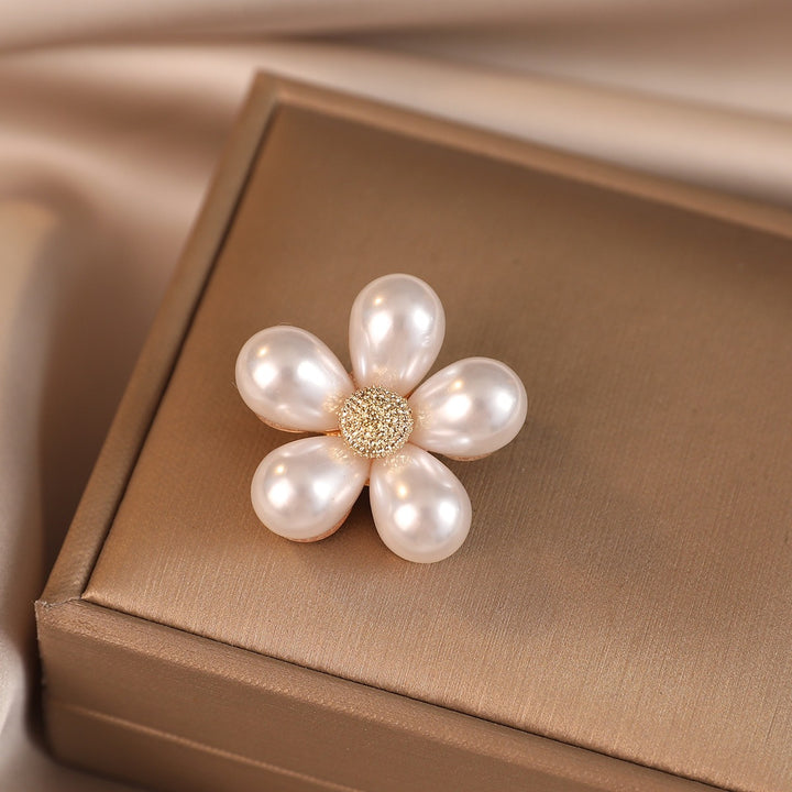 Elegant flower brooch with pearl accents Stornfield