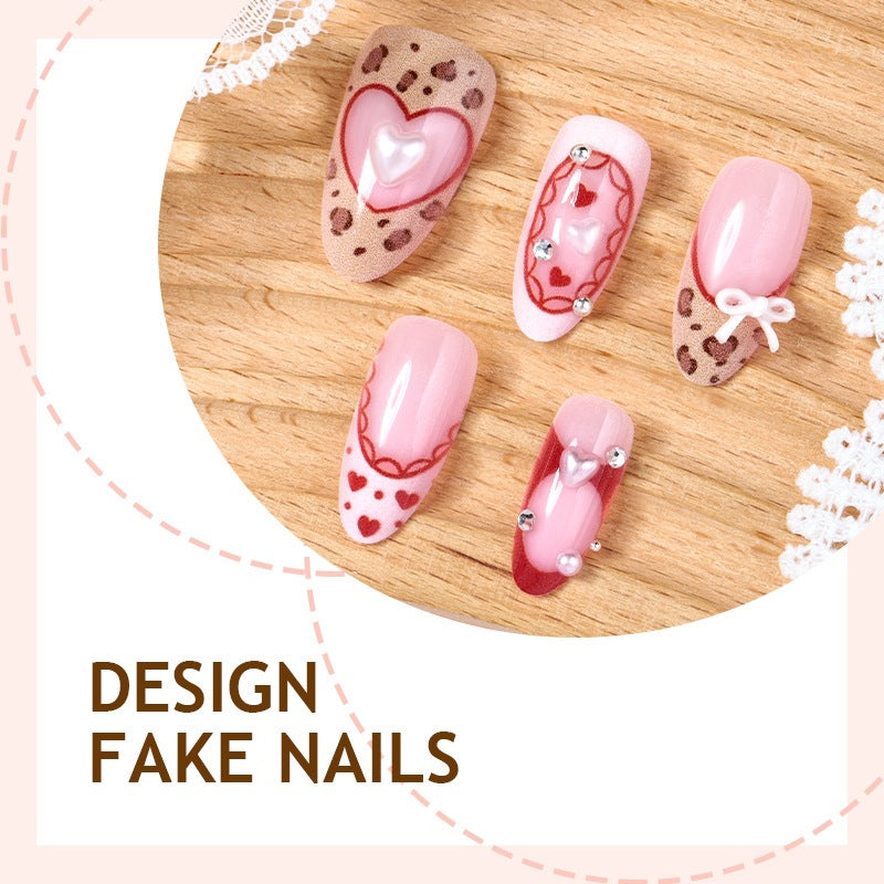Artificial nail set with romantic heart designs and glamorous 3D details Stornfield
