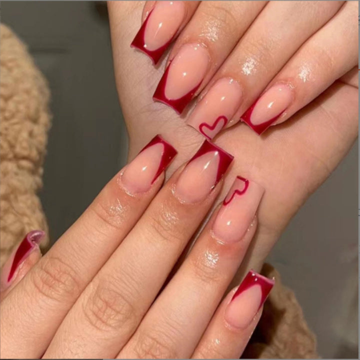Elegant Heart-Embellished Nail Art Design Stornfield